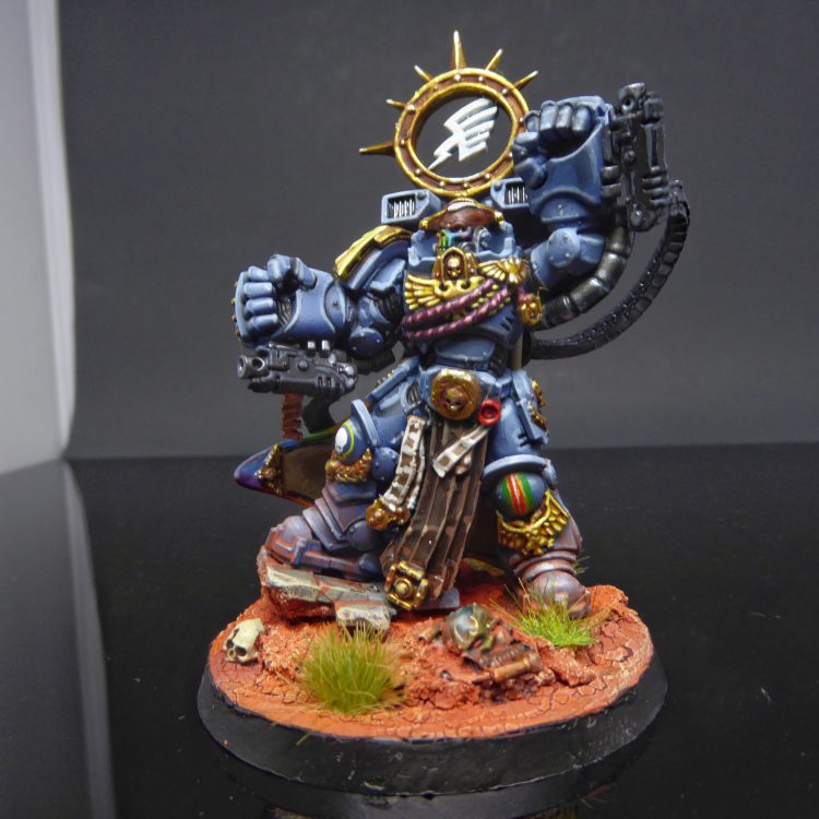 Chapter Master Arcus Pluvius of the Rainbow Warriors armed with the gauntlets Rainbows Duplex