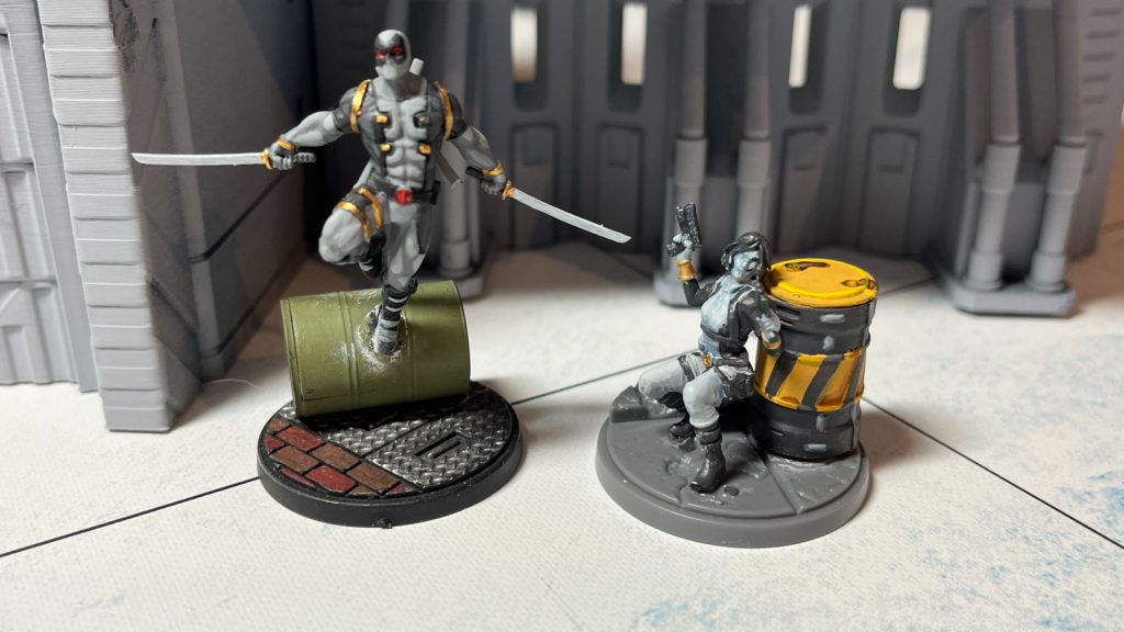 Deadpool and Domino in the snow in Marvel Crisis Protocol