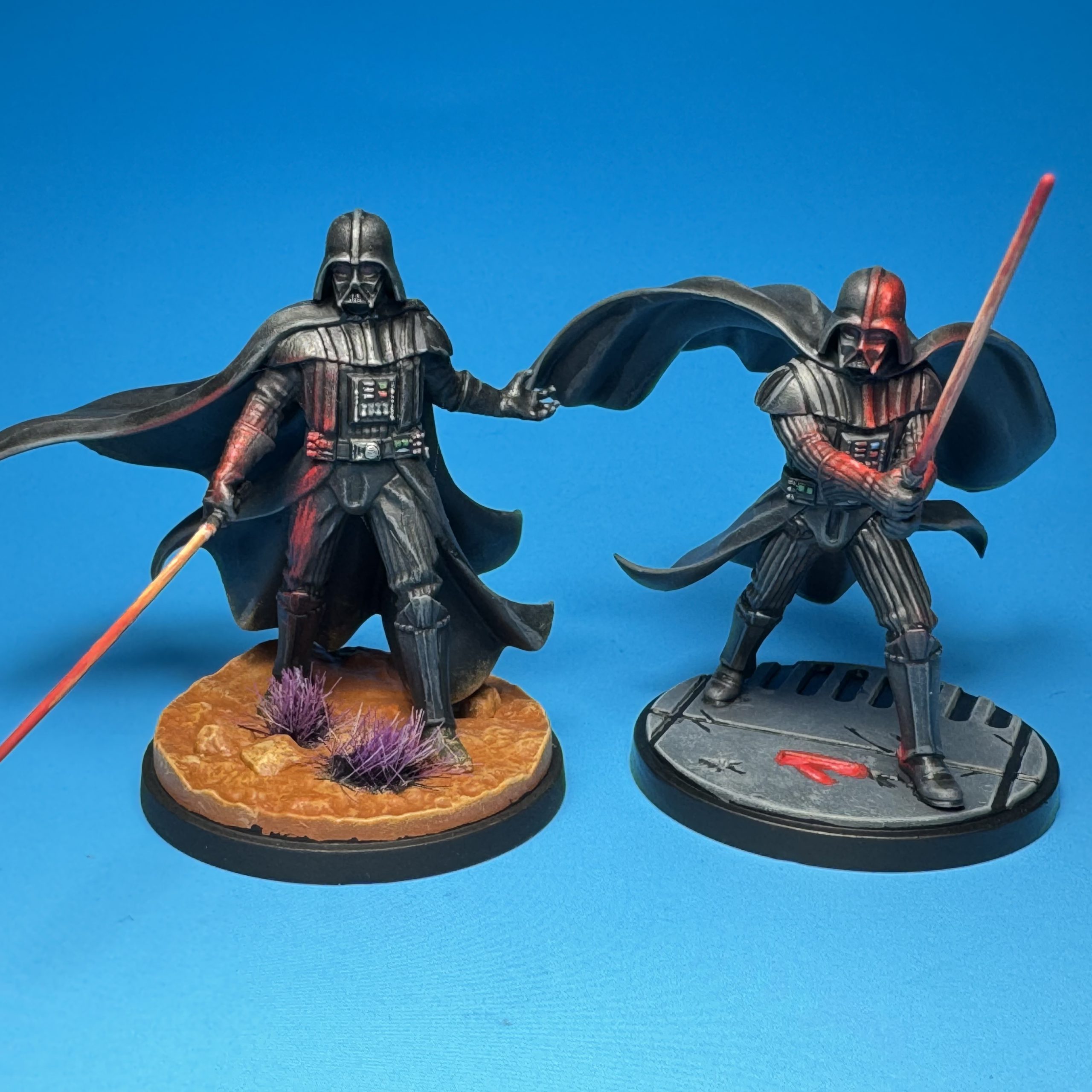 Two versions of Darth Vader painted for Star Wars: Shatterpoint. Credit: McWhat