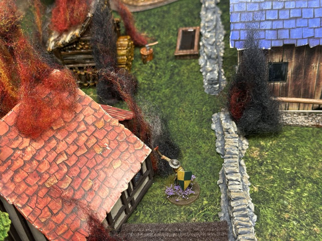 A sergeant burns a village house