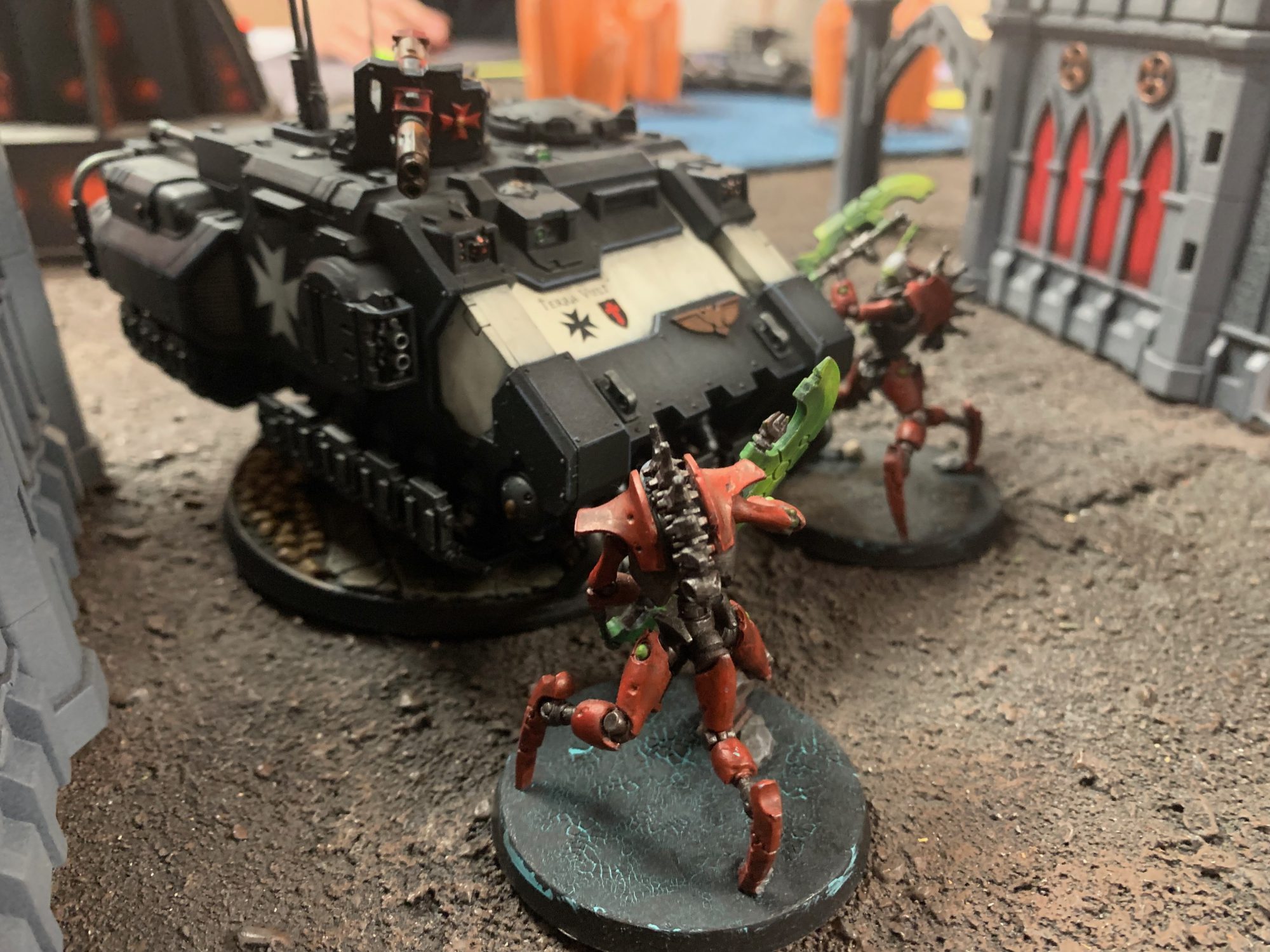 A Black Templar tank is attacked by Necrons